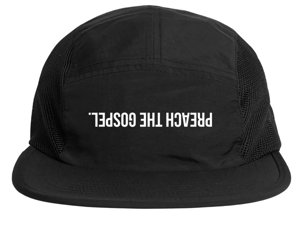 Black cap with 'PREACH THE GOSPEL.' text on a white background