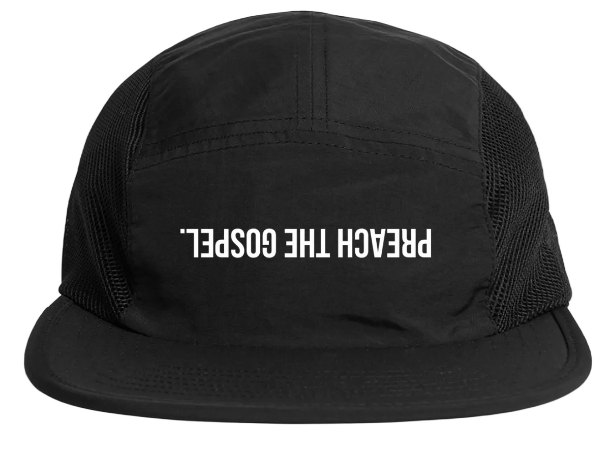 Black cap with 'PREACH THE GOSPEL.' text on a white background